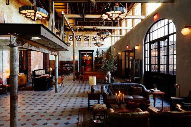 From its mash-up mission-style and Second Empire exterior, Hotel Emma makes a towering statement. Through a colonnade of industrial beams and a set of leaded-glass double doors lies the lobby. #hotelemma #hoteldesign #southwesternhotels